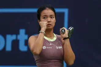 Alex Eala hitting a forehand during a tennis match at the 2025 Miami Open.